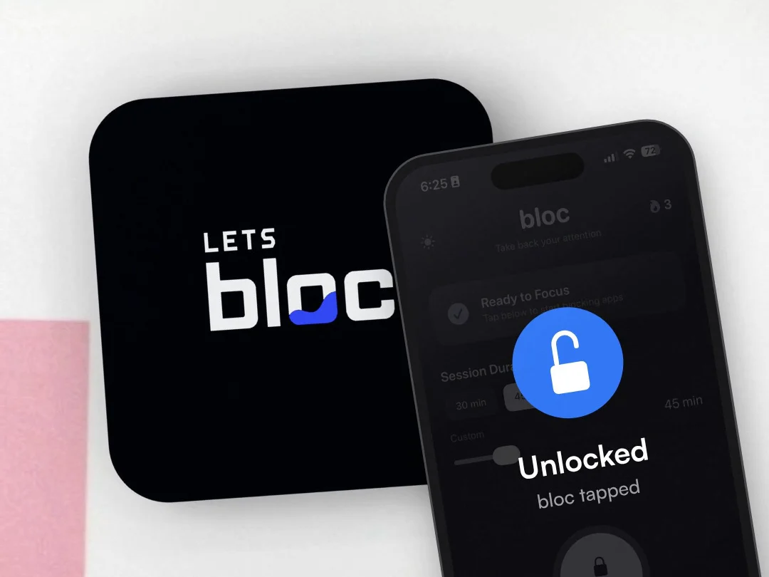 A phone held against a black bloc, the screen showing Unlocked, bloc tapped